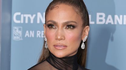 Jennifer Lopez styling out one of the fall makeup looks, golden eyes