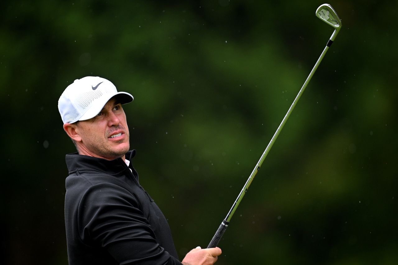 Brooks Koepka hits an iron shot