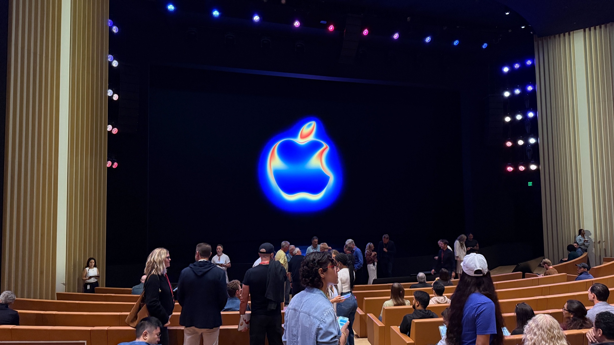 inside steve jobs theater at september 9 launch event with glowing apple logo
