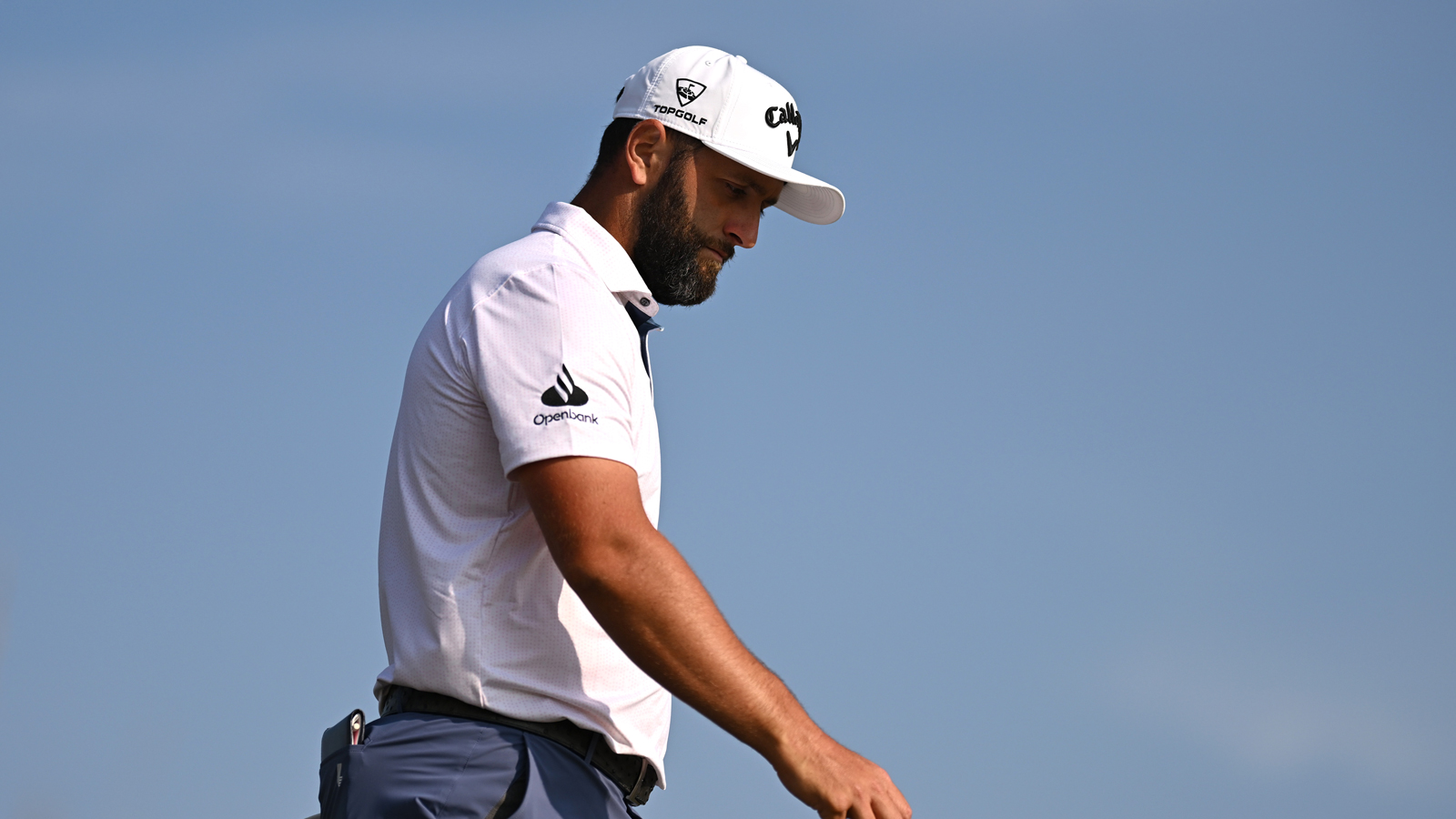 Jon Rahm walks down the fairway