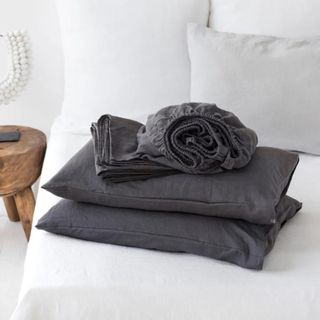 Charcoal Gray Linen Sheets on a white bed.