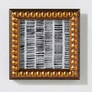 modern art in a gilded frame