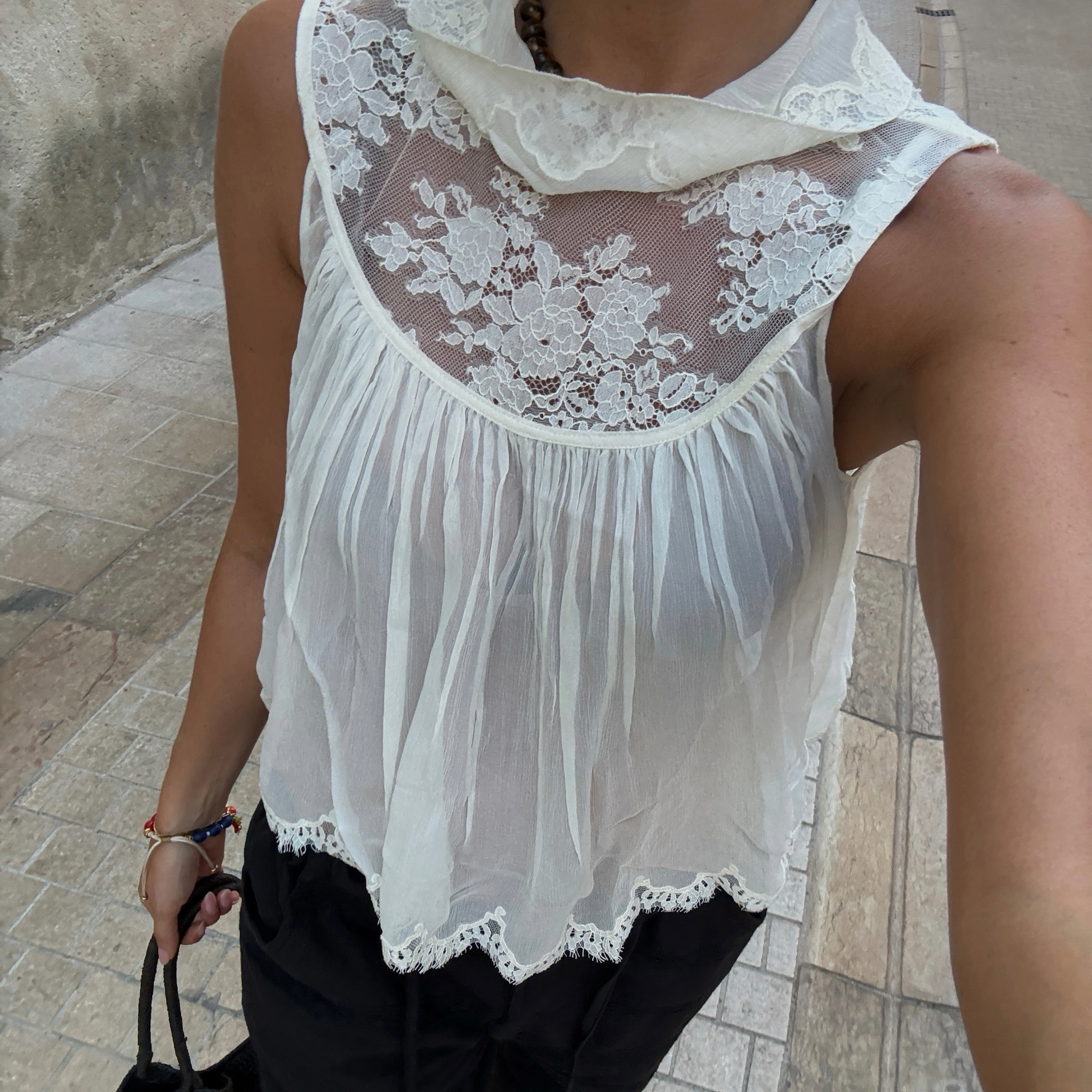Marianne Smyth in a white lace D&ocirc;en top