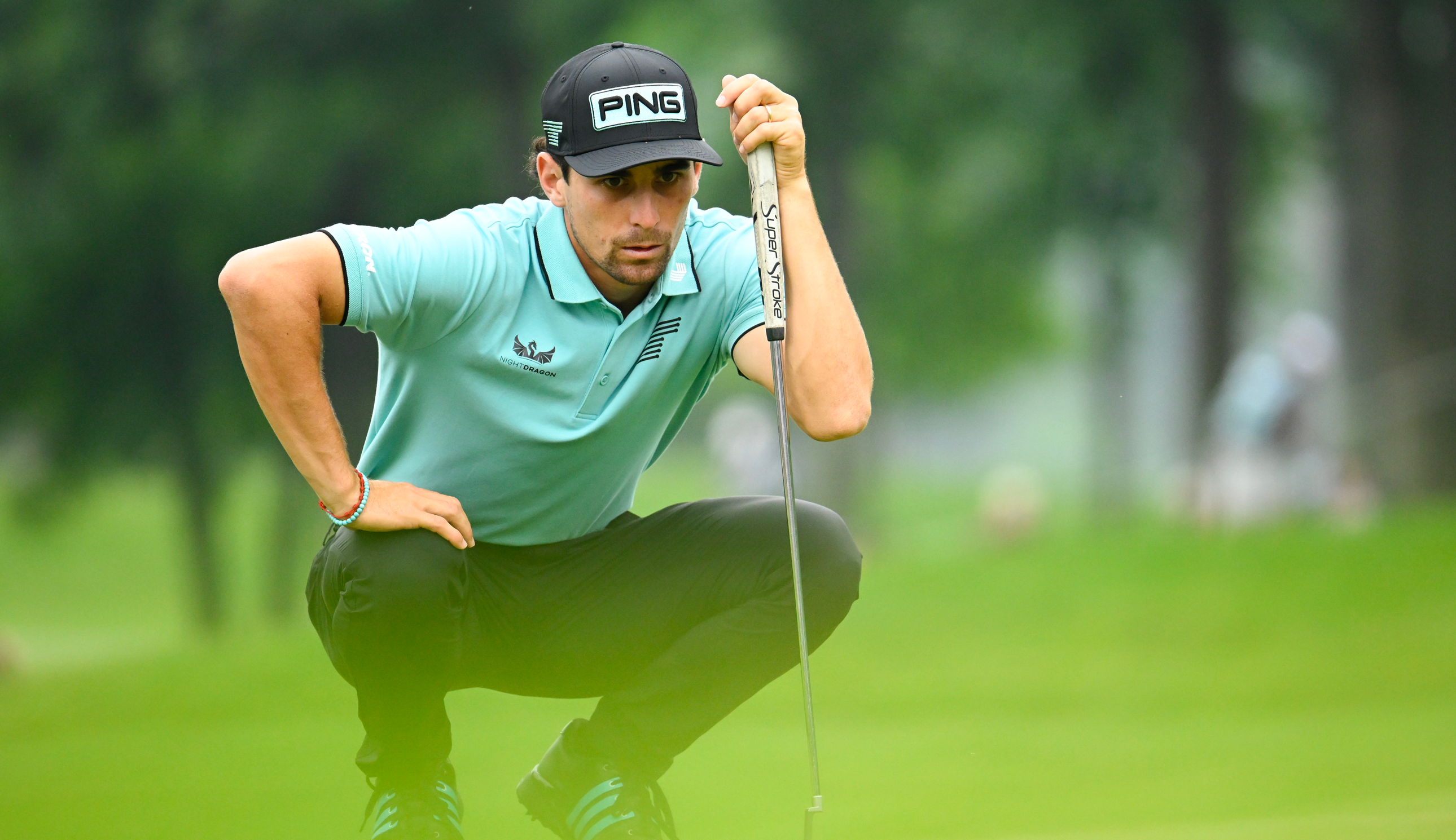 Joaquin Niemann lines up a putt