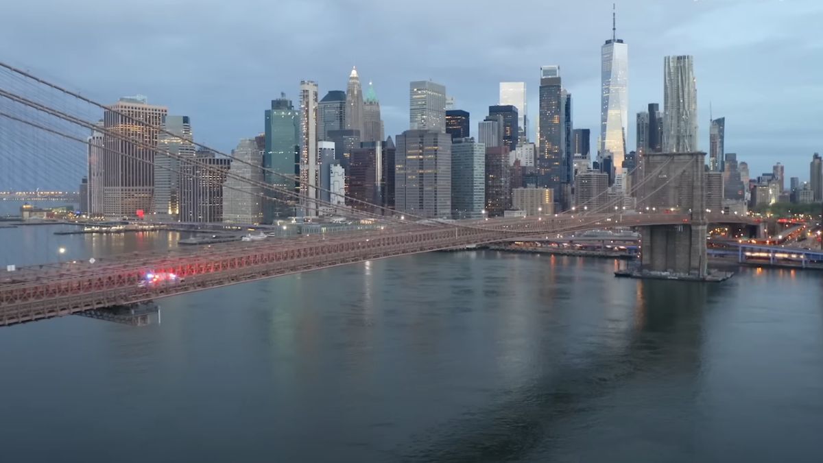 An ambulance drives across the Brooklyn Bridge in Emergency: NYC