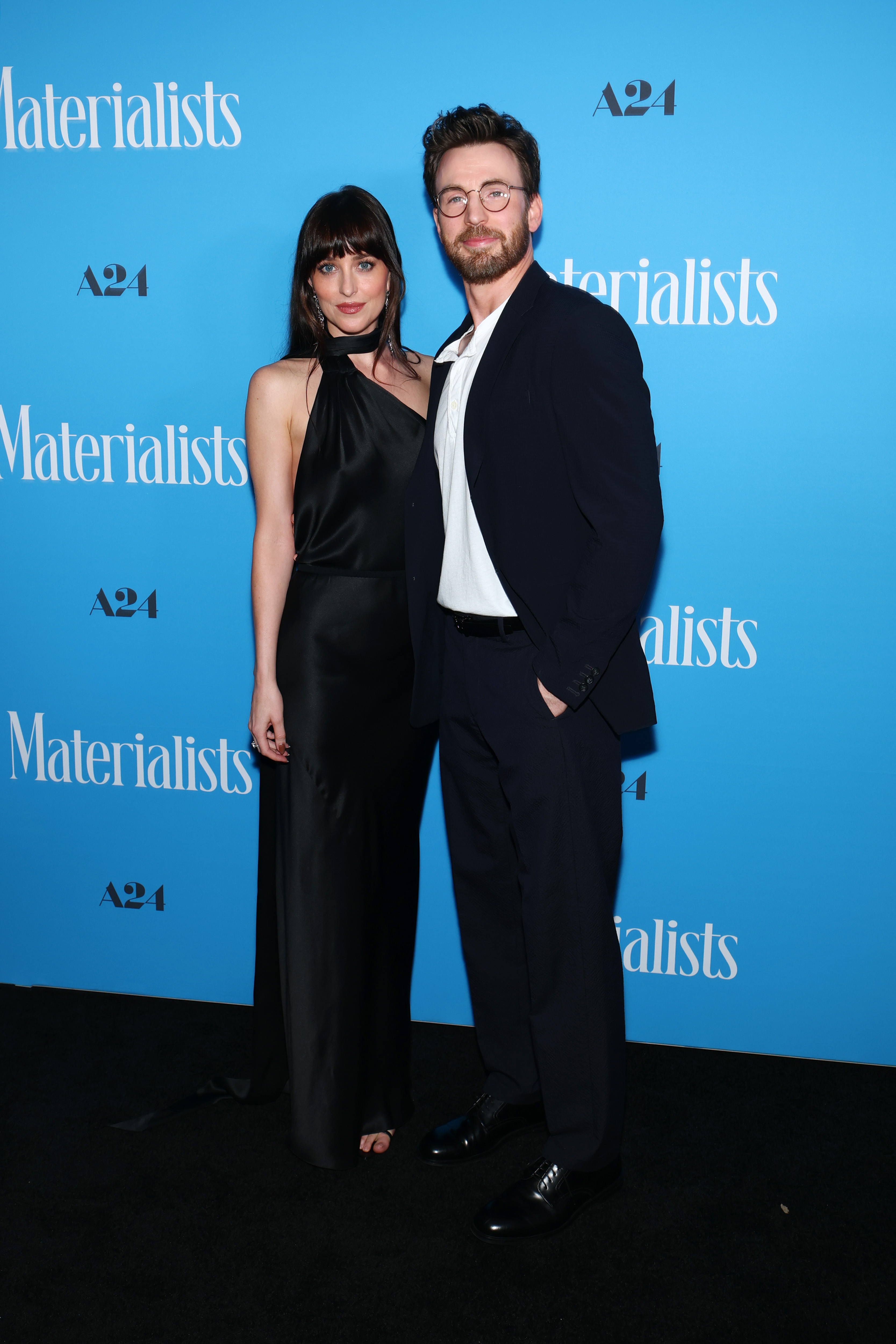 Dakota Johnson wore a black satin Gucci gown at the Materialists premiere