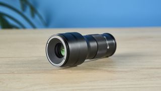 An Apexel TM6 TeleMacro lens for smartphones