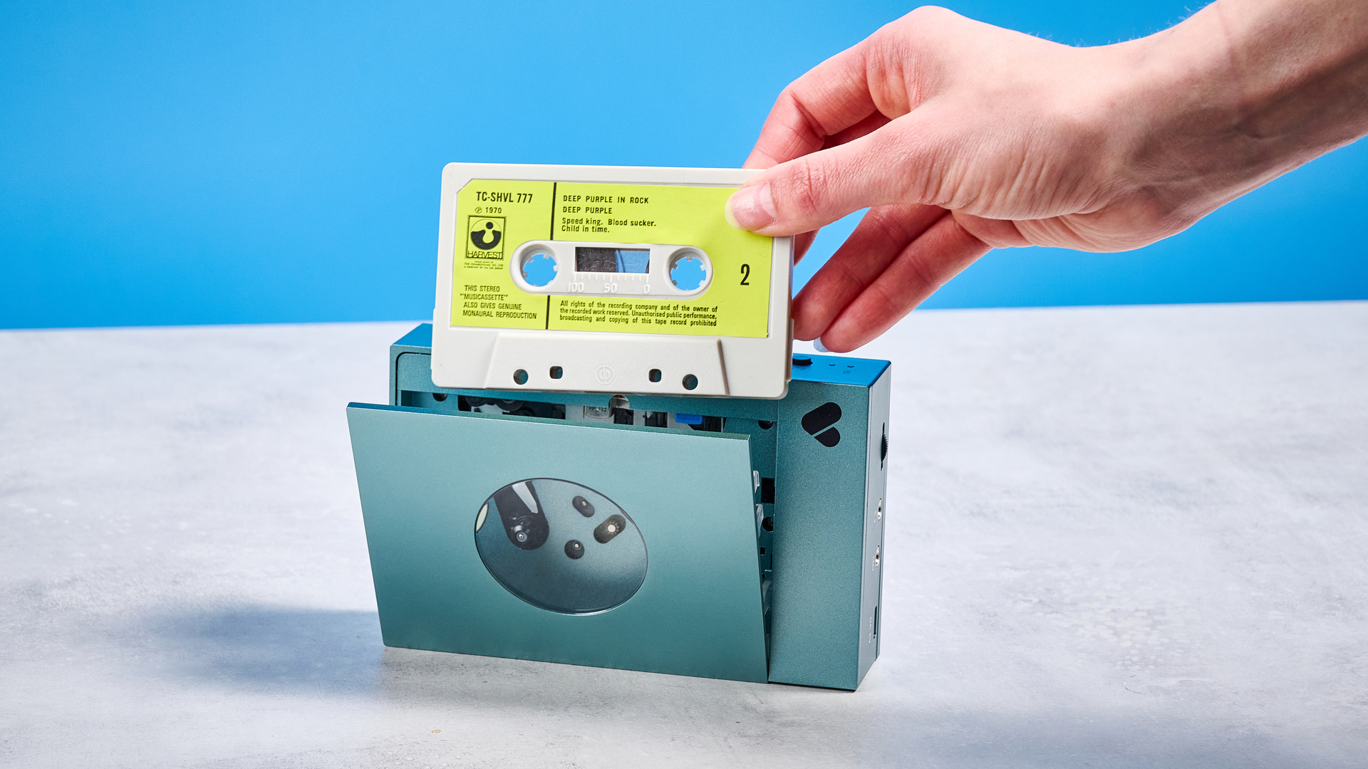 We Are Rewind Cassette Player in blue photographed in front of a blue background