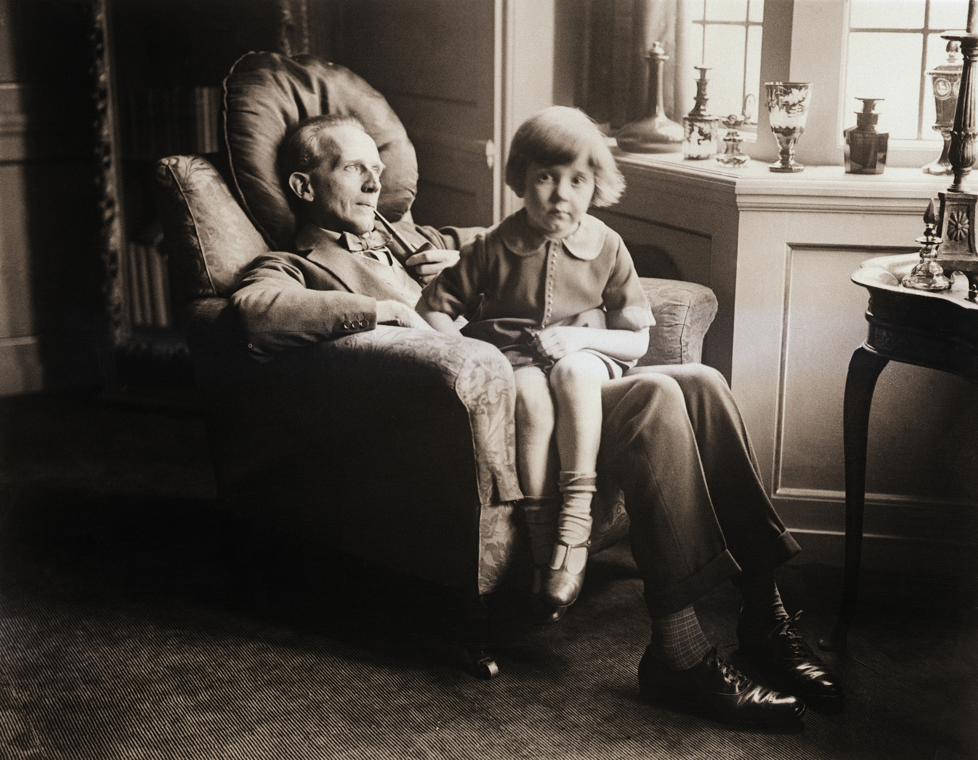 A.A. Milne with his no less famous son, Christopher Robin at their home in England