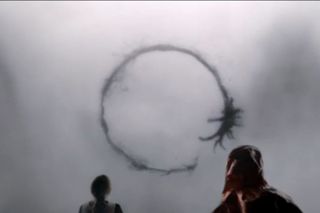 Humans work to interpret the inky written language of an alien species in the movie "Arrival."