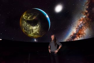 American Museum of Natural History's Director of Visualization Carter Emmart stares at a visualization of the planetarium show "Musica Universalis: The Greatest Story Ever Told."