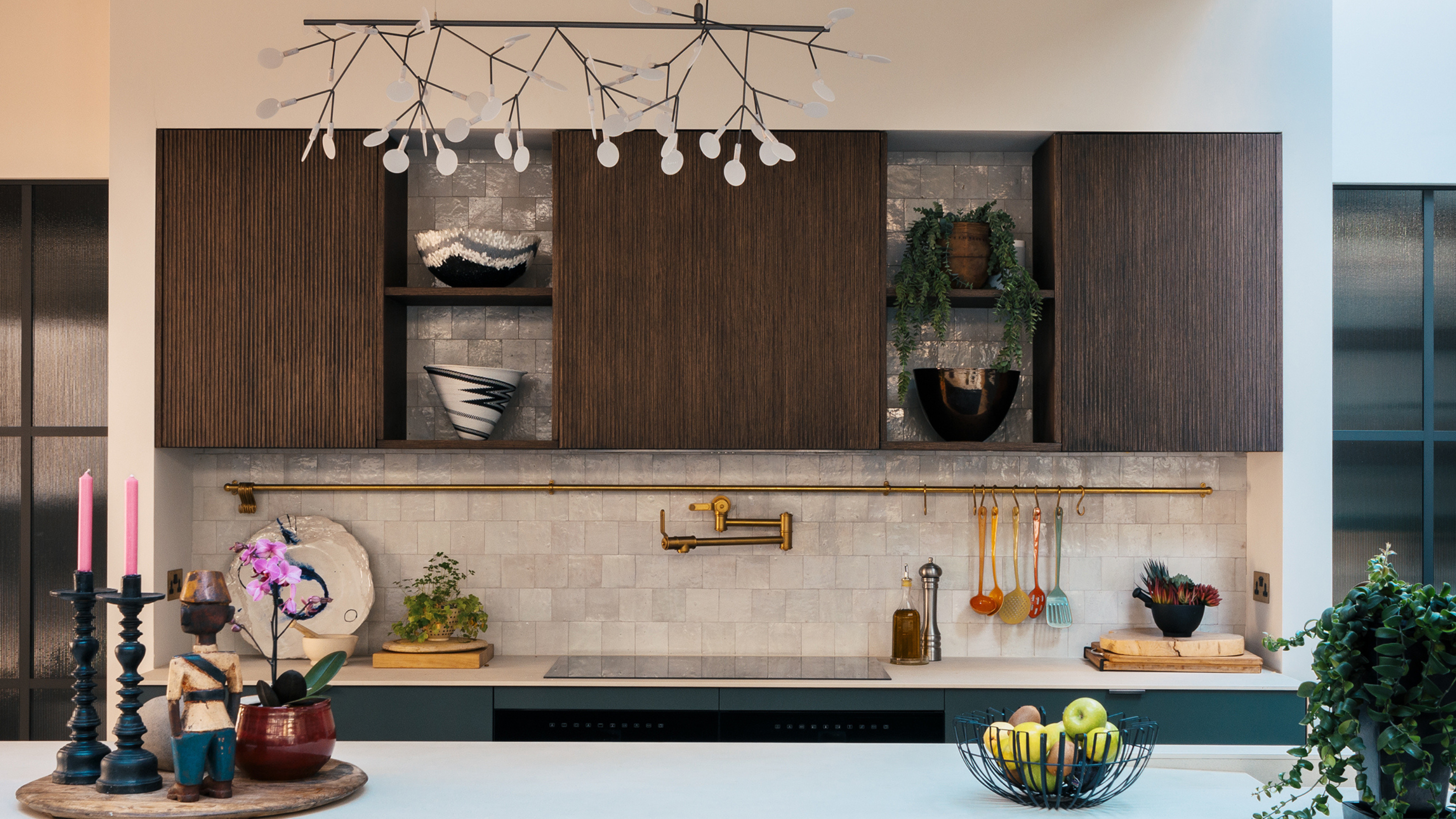 beautiful kitchen counter with white zellige tile backsplash and wooden cabinets