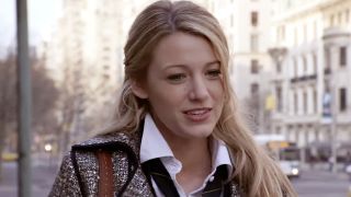 Blake Lively wearing an open collar and hair pulled back while on the streets of NYC in Gossip Girl. 