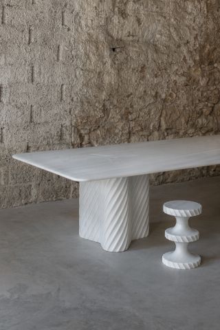White marble table and stool, part of India Mahdavi Achromia show at Carwan Gallery