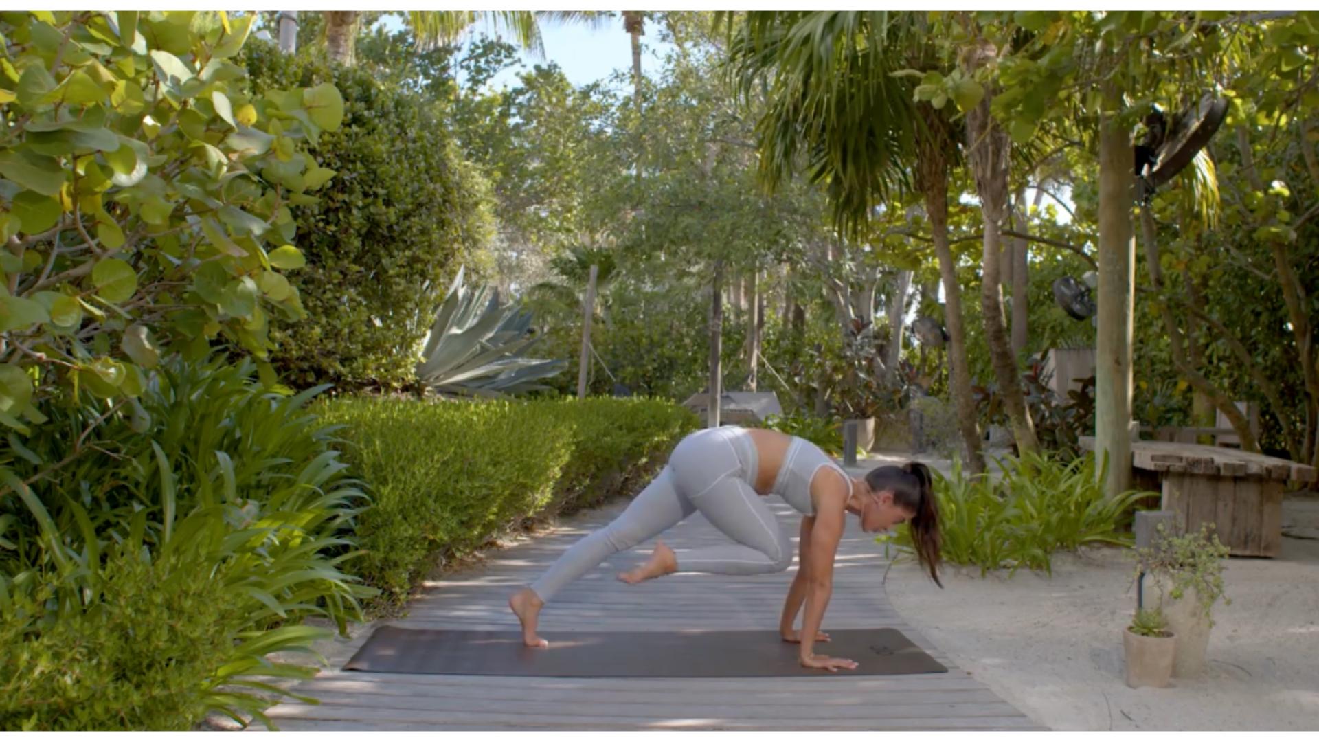 woman does yoga outdoors