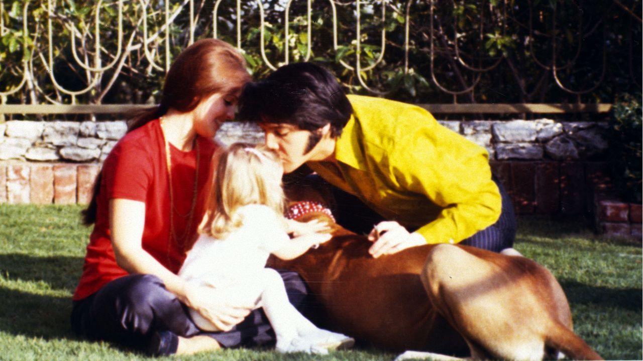 Elvis and Priscilla Presley with Lisa Marie.