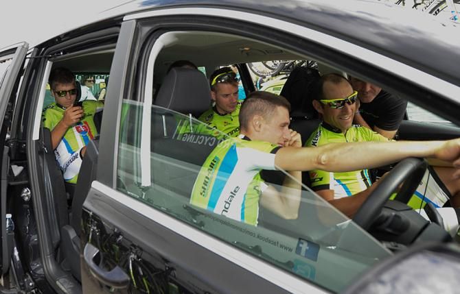 Peter Sagan of Team Cannondale sits in the back of his team car with his team mates, Paolo Longo Borghhini, Tiziano Dall'Antonia, Lucas Sebastian Haedo, Damiano Caruso, Fabio Sabatini
