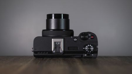 Canon PowerShot V1 on a wooden surface