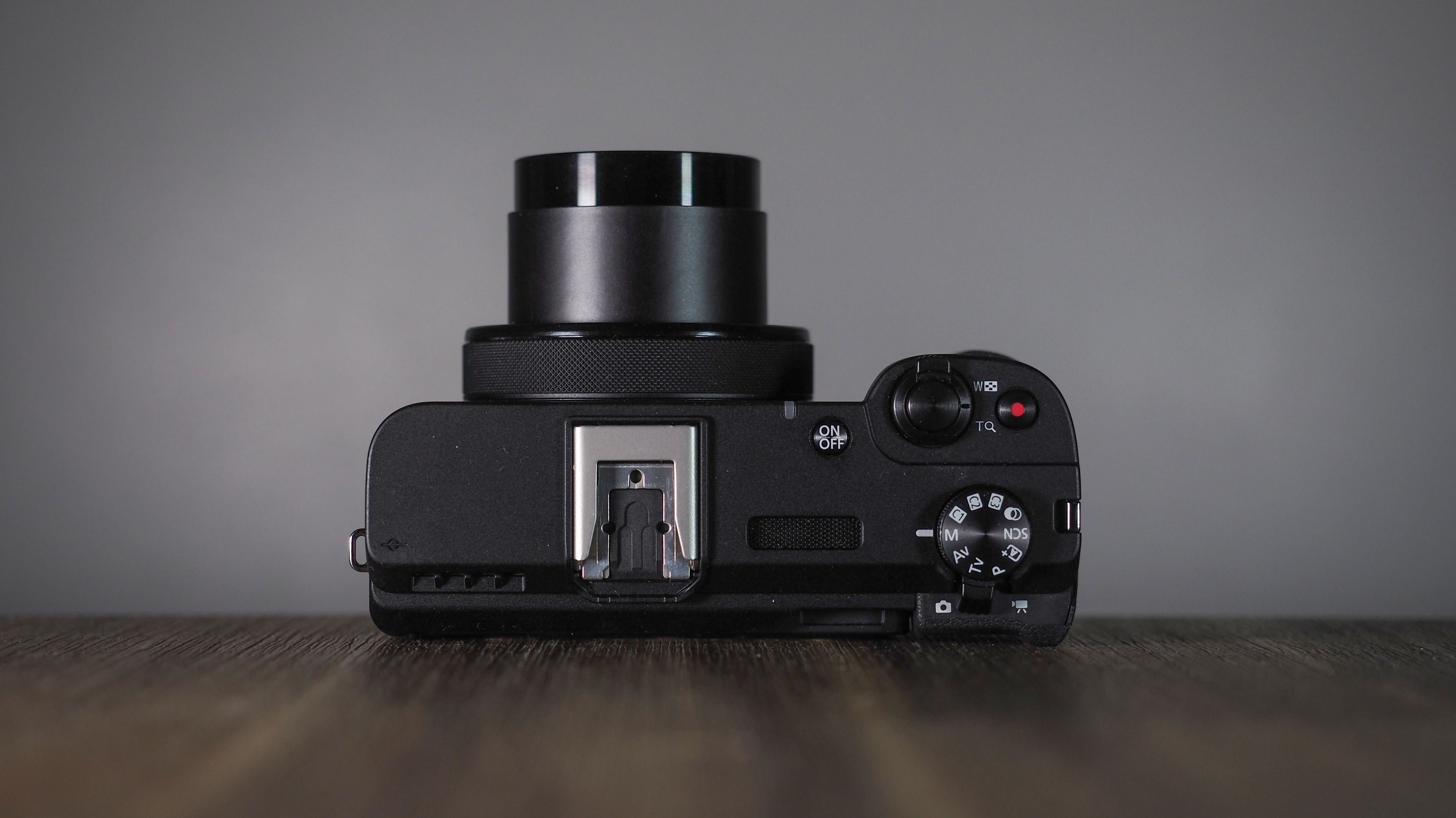 Canon PowerShot V1 on a wooden surface