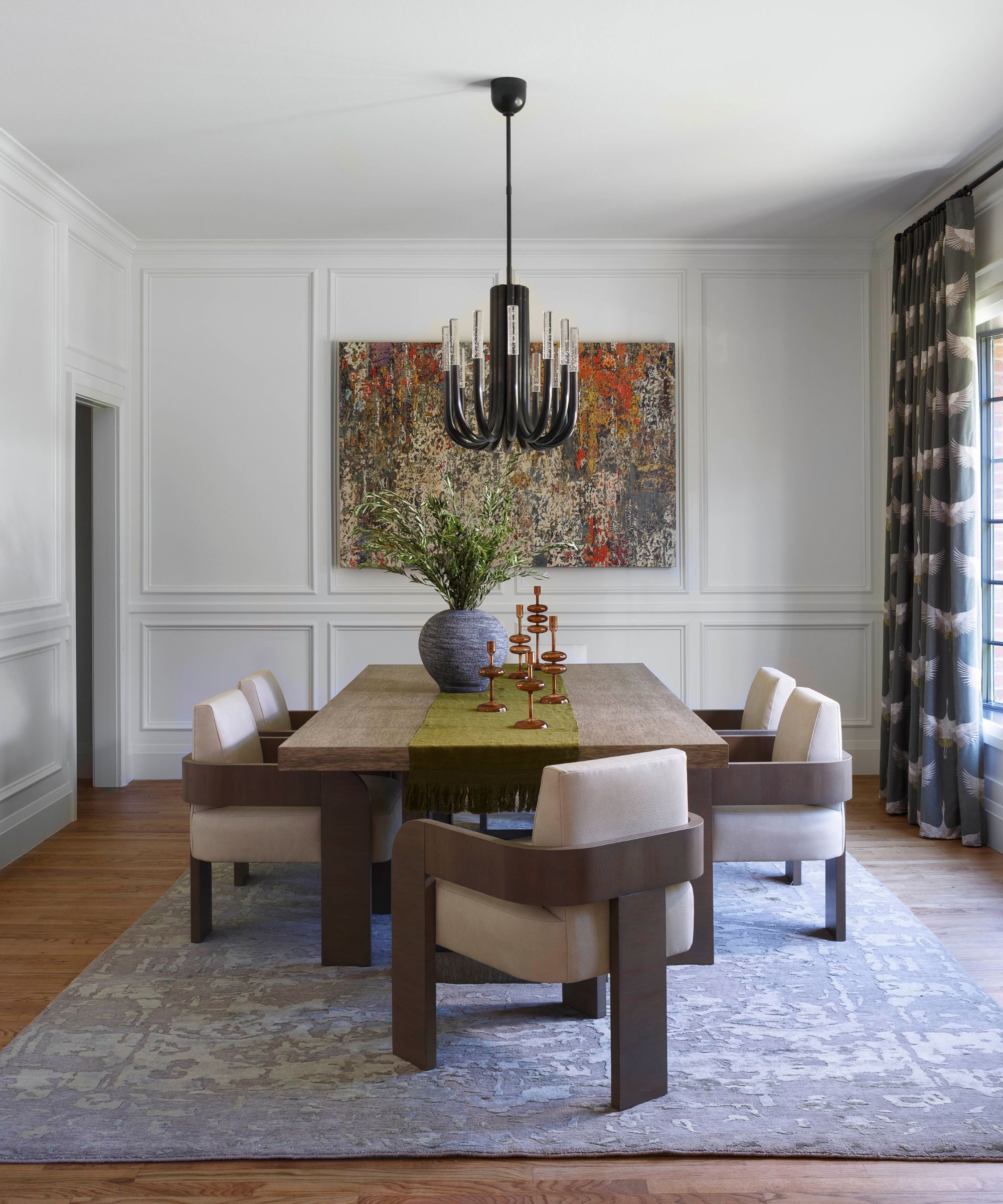 Dining room with modern wooden dining table and large rug gray underneath