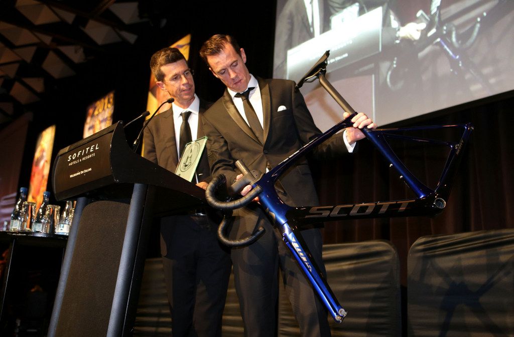 May Hayman inspects his custom Scott bike