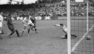 Gunnar Andersson (in white) scores a goal for Marseille against Stade-Français in 1952.