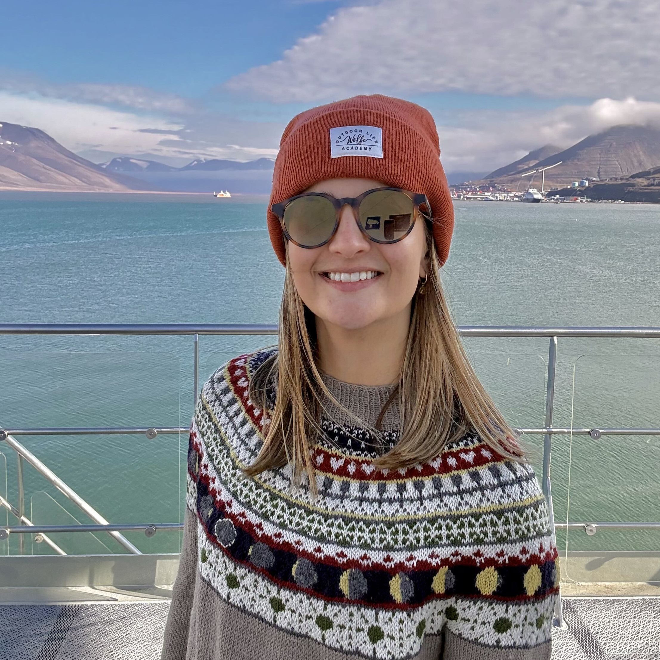 a person wearing a knitted sweater with the phases of the total solar eclipse on.