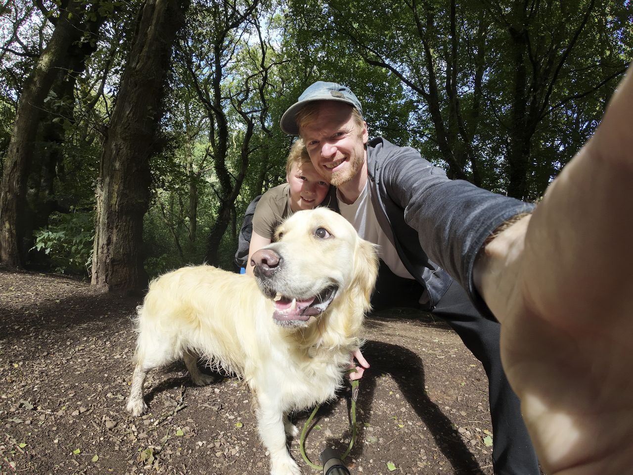 Man, boy and dog selfie