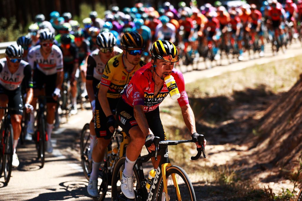 Primož Roglič (Jumbo-Visma) tries to hydrate during hot day of racing