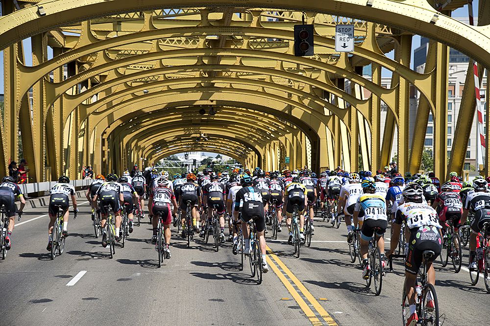 The Tour of California rides over a bridge in Sacramento