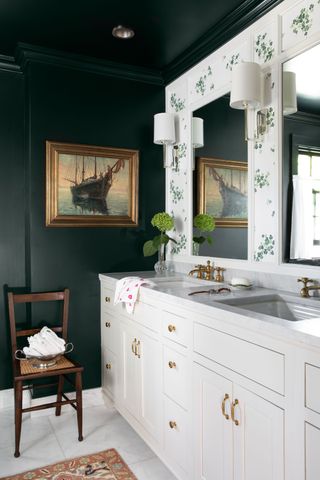 green bathroom with dark green wall and ceiling, green wallpaper and white floor and white basin units