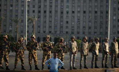Egyptian soldiers stand guard