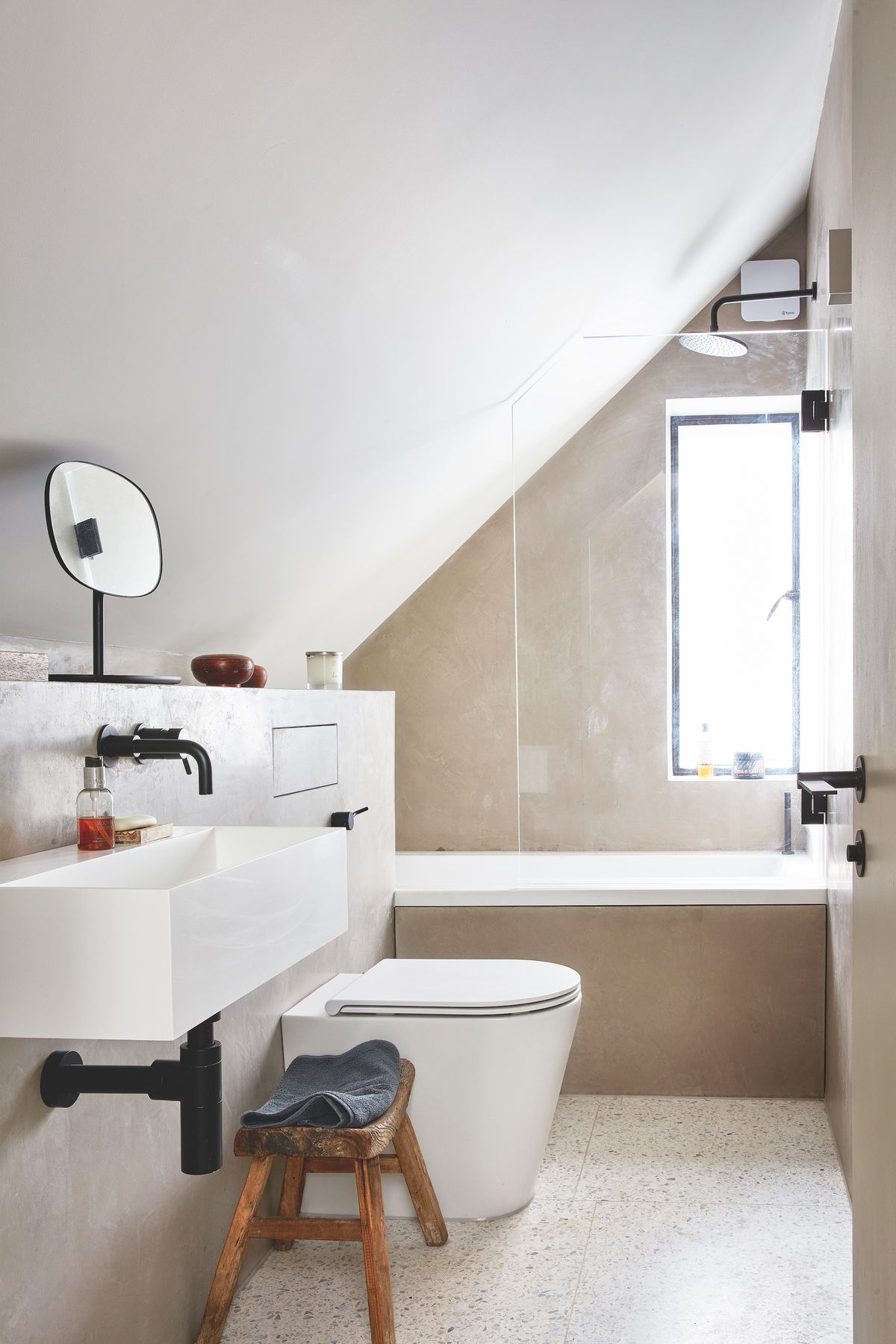 white bathroom with vaulted ceiling