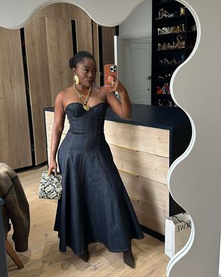 Fisayo Longe wearing a raw denim dress