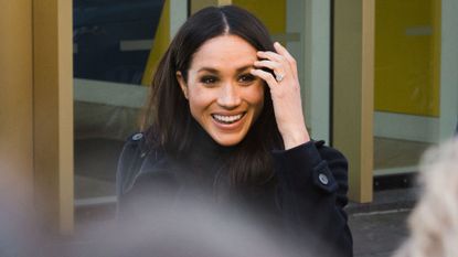 Apparently, this is why Meghan Markle is always fiddling with her hair |  Marie Claire UK
