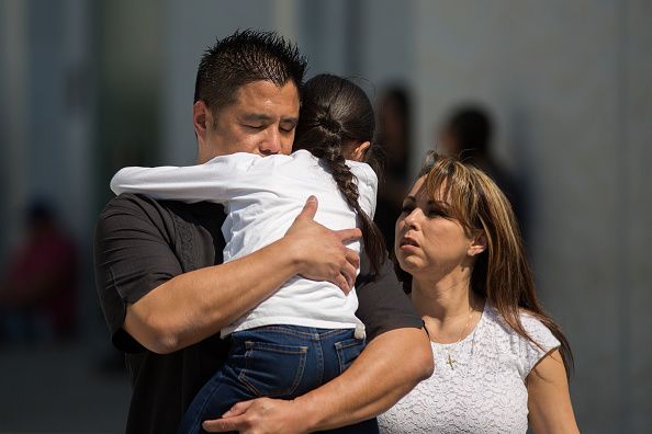 A family reunites after the shooting in San Bernardino.