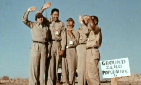 Five Air Force men are pictured July 19, 1957, moments before an atomic warhead exploded in the atmosphere above them as part of a safety experiment.