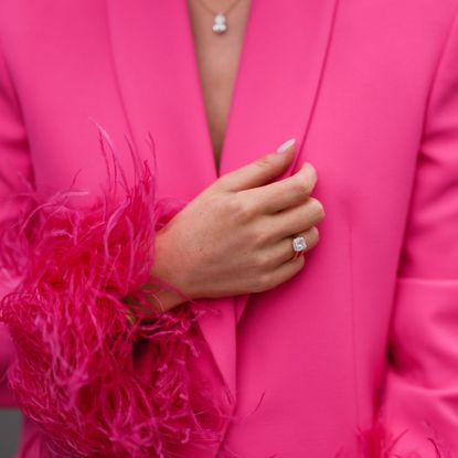 Leo Eberlin is seen wearing an engagement ring, a pink blazer two-piece with feather details from Zara, diamond necklace from Leo Mathild and Leo Mathild diamond ring, on September 04, 2022 in Berlin, Germany.