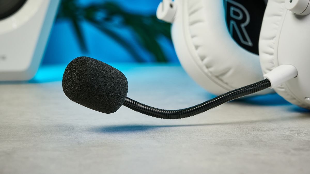 The Logitech G Pro X3 Lightspeed headset in white, on a stone surface.