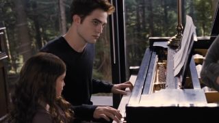 Edward playing piano with Renesmee