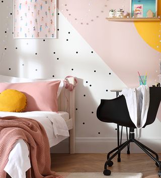 teen bedroom with pink and white diagonal paint effect