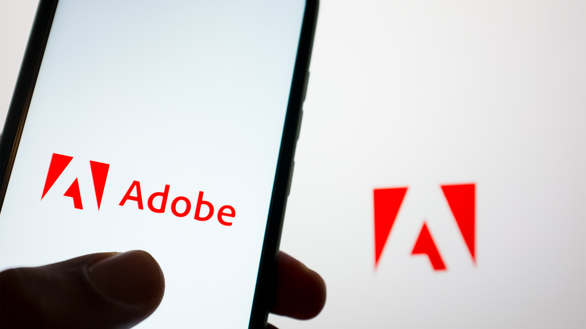 Adobe clarifies new terms of service after AI model training concerns ...