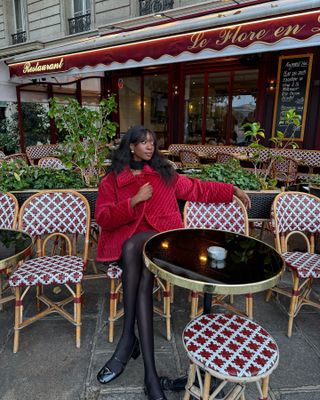 Influencer wearing red Posse velvet jacket.