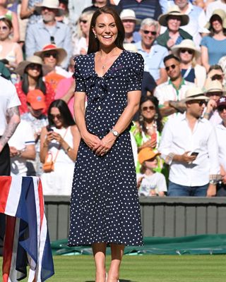Kate Middleton wearing a navy polka dot dress at wimbledon tennis