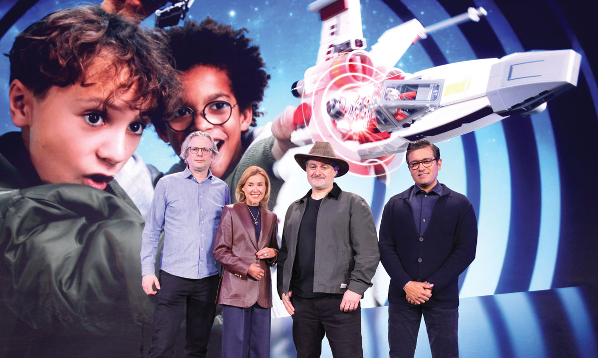 Chewbacca, C-3PO, R2-D2 join Dave Filoni and others on stage at CES to introduce the new LEGO Smart Brick.