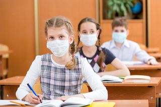 schoolgirls wearing face masks against flu