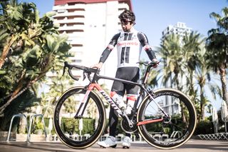 Matthews stands with his Giant TCR Advanced SL