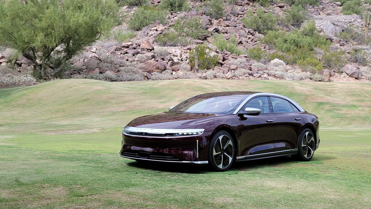 Side view of a car parked on grass