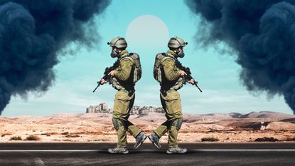 Two IDF soldiers walking in opposite directions towards smoke
