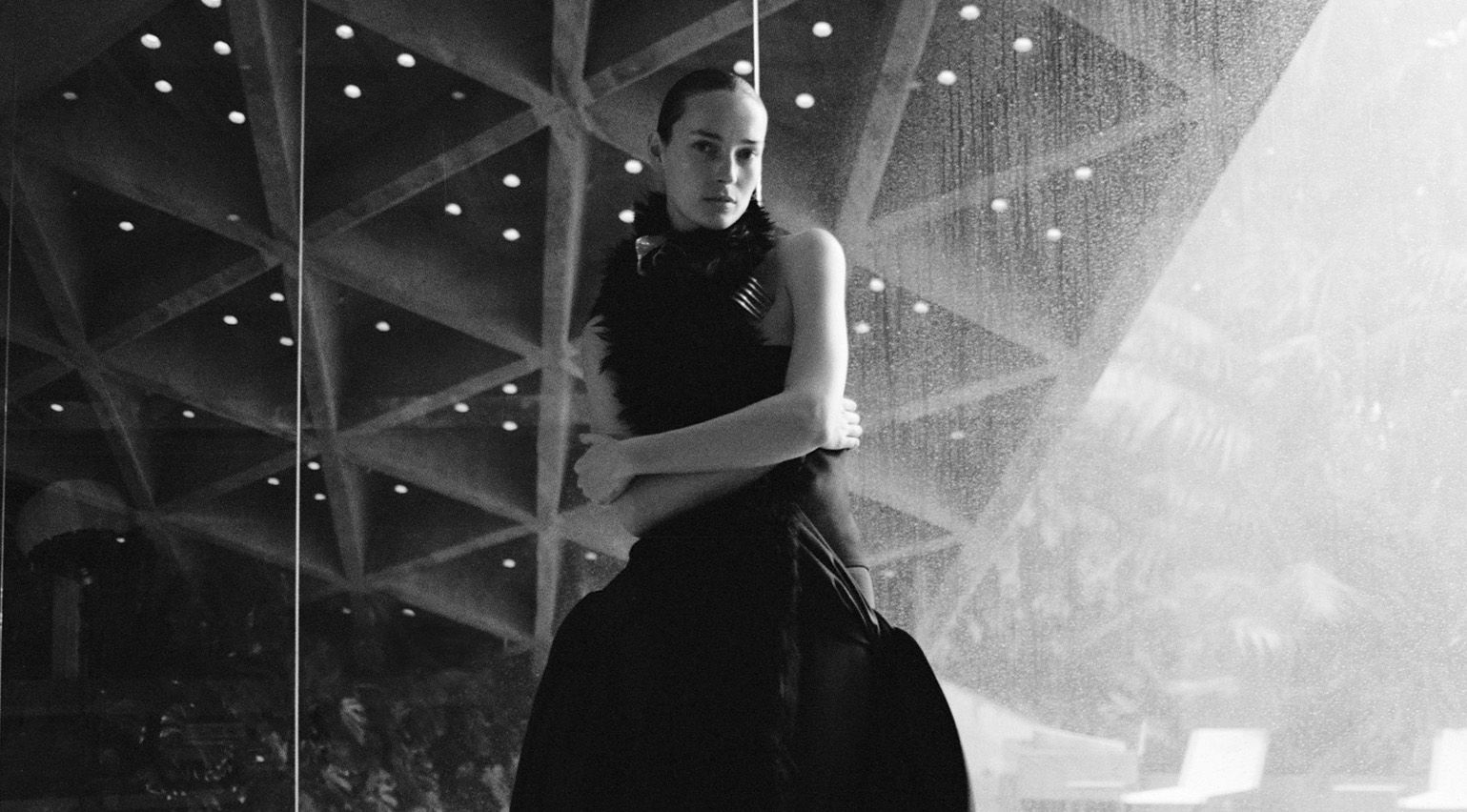 Cinematic Pre-Fall 2026 fashion shot in a John Lautner masterpiece in Los Angeles